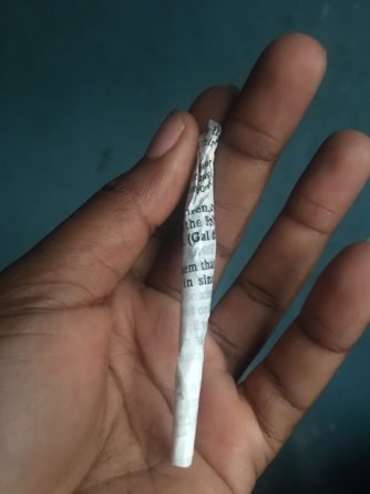 Nigerian lady uses bible as weed wrap